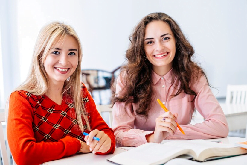 two girls learning German